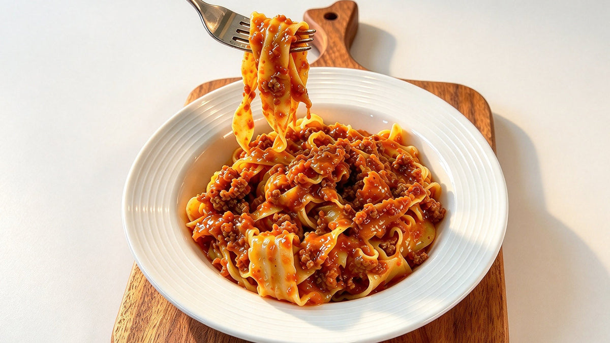 Creamy Bolognese sauce made in the JESE Heated Pro, served over pappardelle