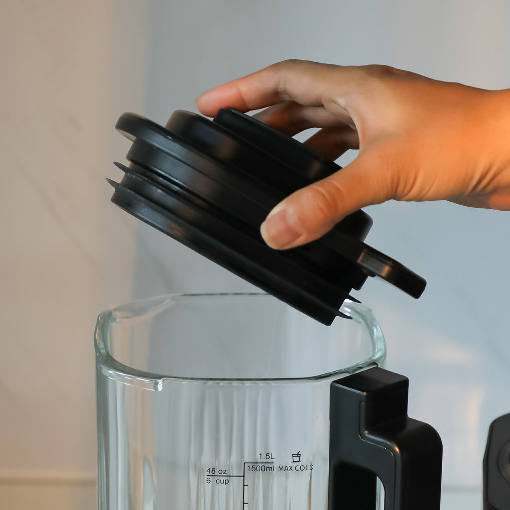 The JESE Heated Blender comes with a 48 Oz thick glass jar featuring clear measurement markings for accurate ingredient preparation. The spacious container is ideal for family-size smoothies, soups, and homemade recipes.